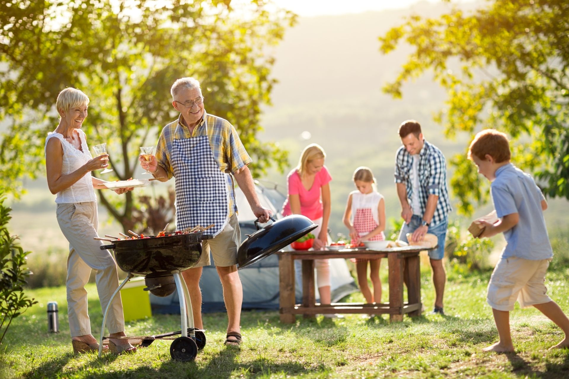 Image of family barbecuing outdoors